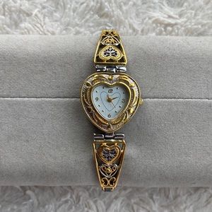 Heart shaped silver and gold colored metal watch. 💛💫